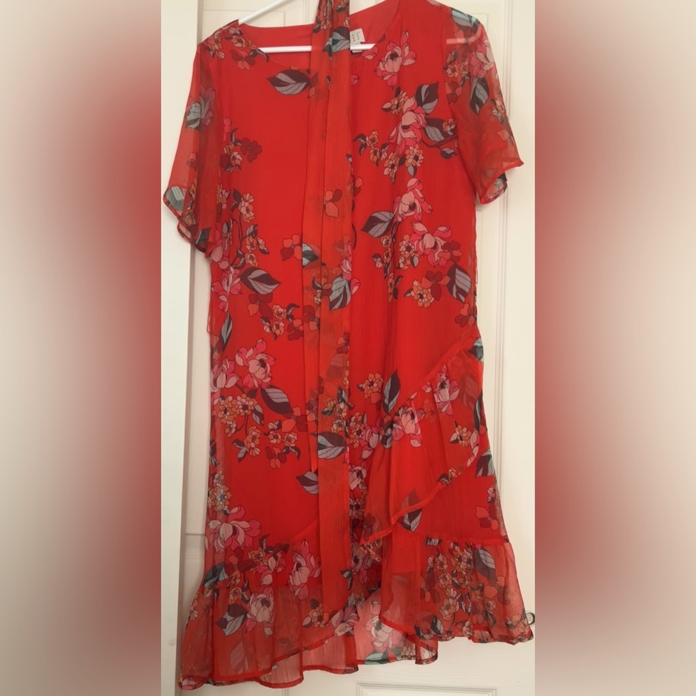 Red chiffon style floral dress with ruffle at the bottom